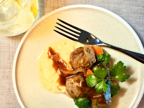 Beef rissoles on mashed potato and seasonal vegetables