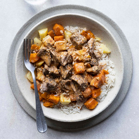 Massaman lamb curry with rice and vegetables